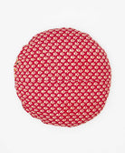 round throw pillow sustaibaly made using red upcycled vintage saris 