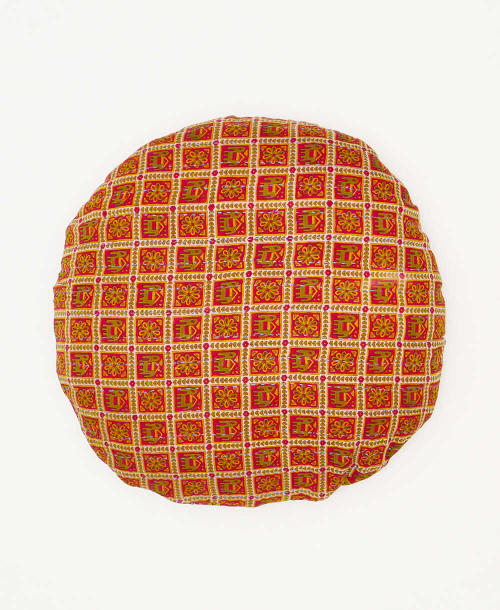 round pillow sustainably created using repurposed elephant print saris 