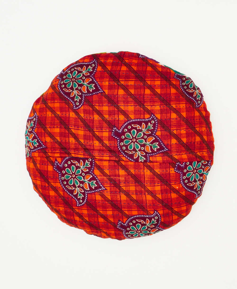 round throw pillow featuting a hexagon pattern handmade by women 