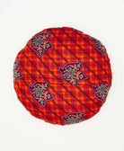 round throw pillow featuting a hexagon pattern handmade by women 