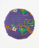 round throw pillow featuring a floral print and traditional kantha hand stitching 