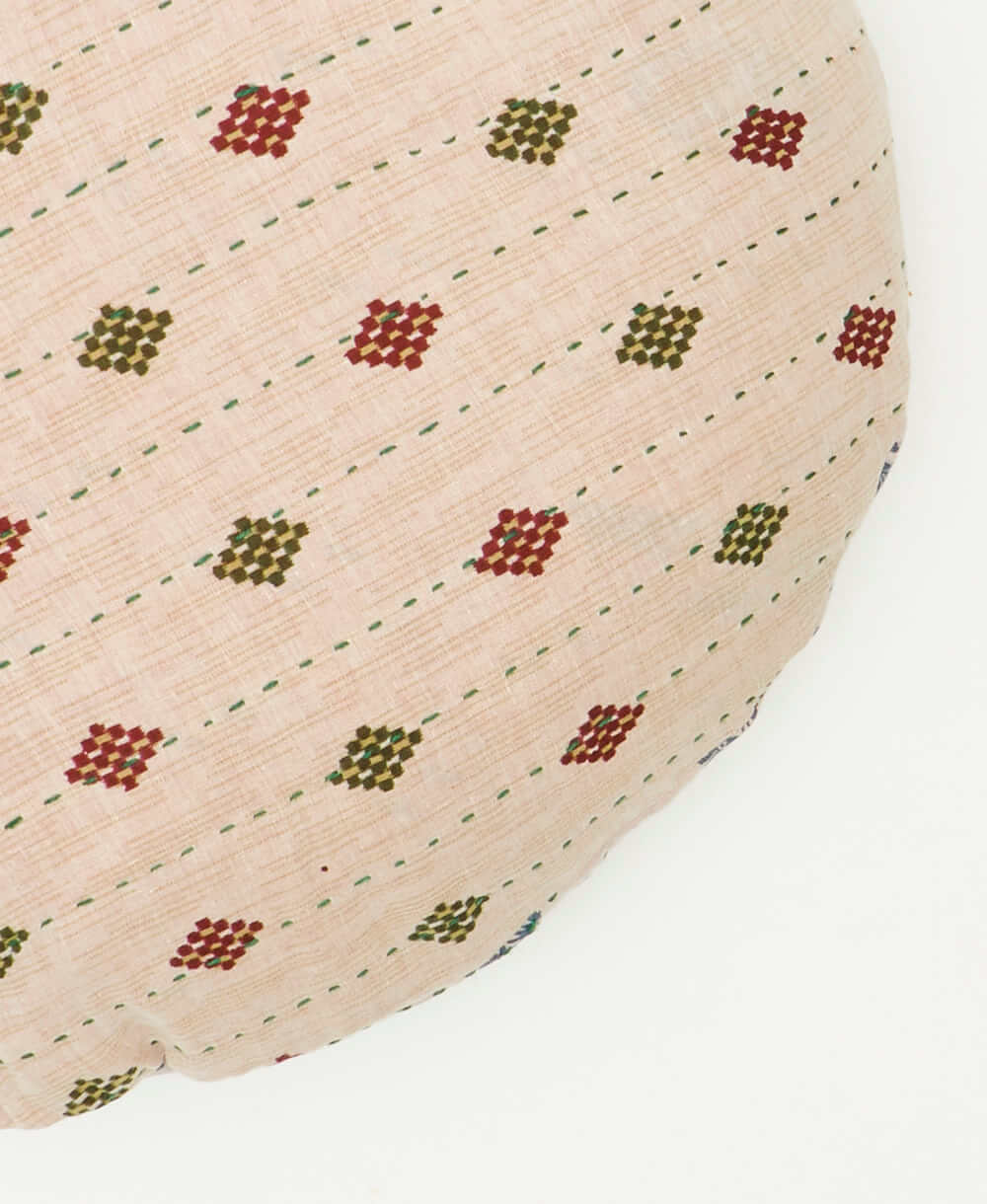 circle pillow crafted from saris featuring traditional kantha hand stitching 