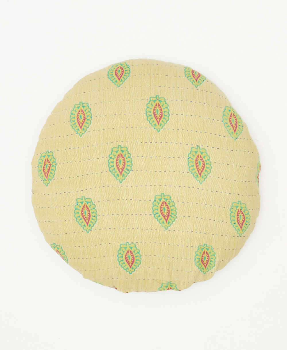 round throw pillow hand made by artisans in india featuring a stamp print 