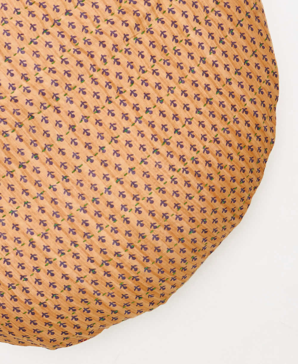 camel circle pillow made of recycled vintage fabrics with green embroidery 