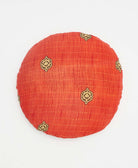 red and yellow simple floral round pillow with handstitched details 