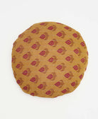 camel brown round pillow with red floral details 