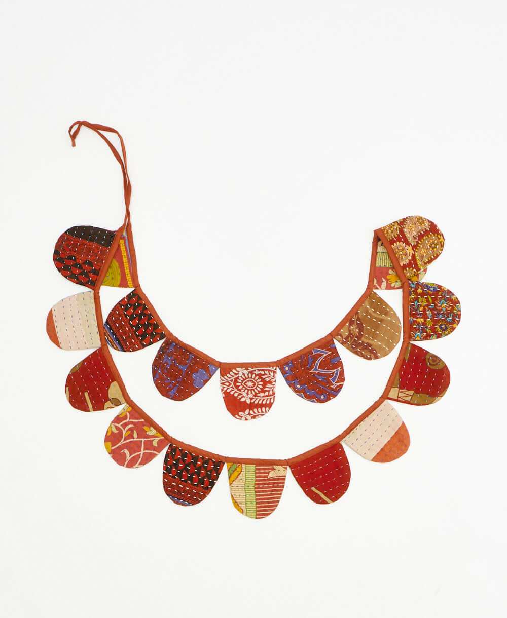 upcycled fabric garland with bold burnt orange abstract pattern by Anchal