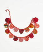 upcycled fabric garland with bold orange and red abstract print pattern by Anchal