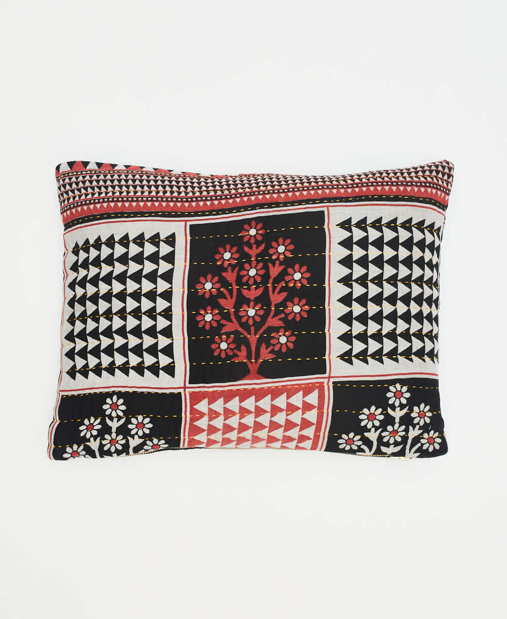 small pillow in bold grey, black and red graphic print with red tree pattern