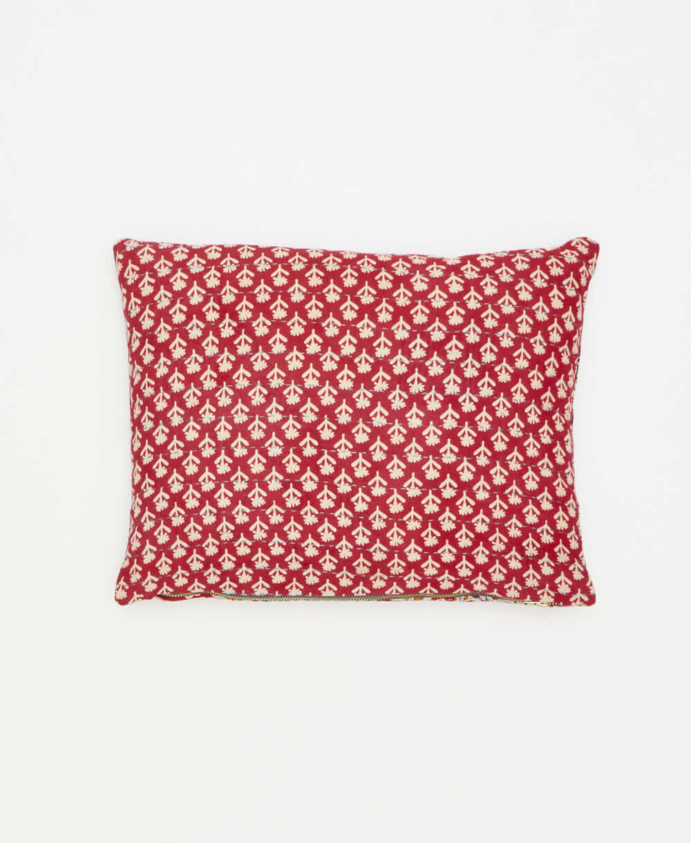 handmade in india, this small pillow features a white floral print 