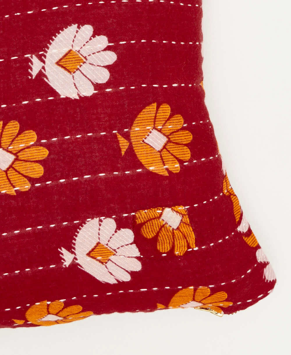 red traditional kantha hand stitching on a sustainably made orange floral  small throw pillow 