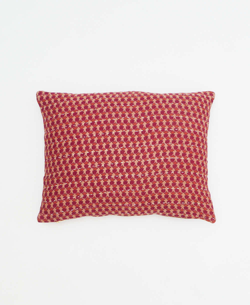 small lumbar pillow in hot pink with orange leaf print with removeable down feather insert