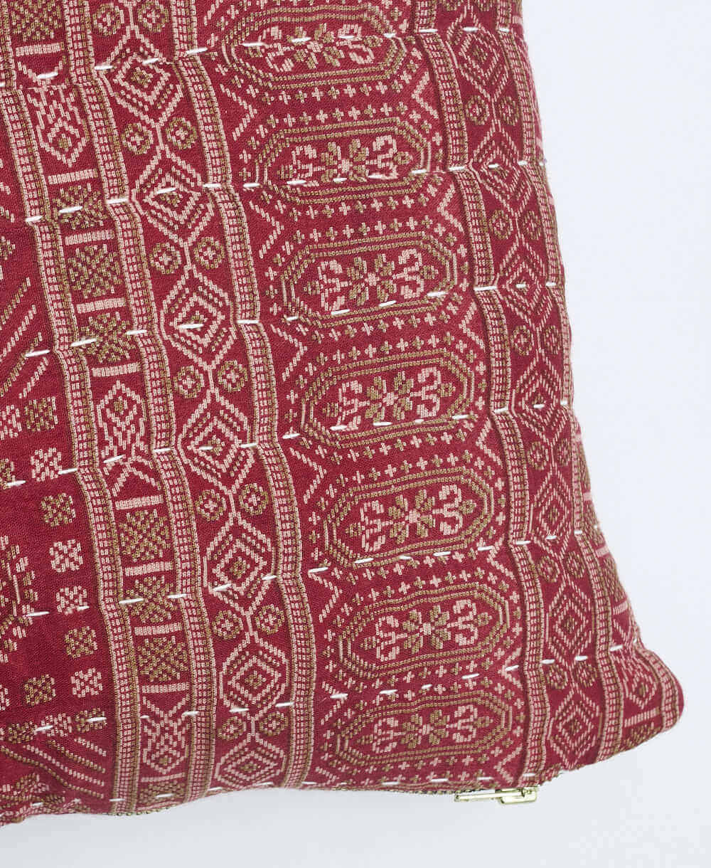 white kantha embroidery on muted red small throw pillow with tan & white traditional print