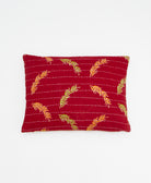 small lumbar pillow in bright red with orange & lime leaf print with removeable down feather insert