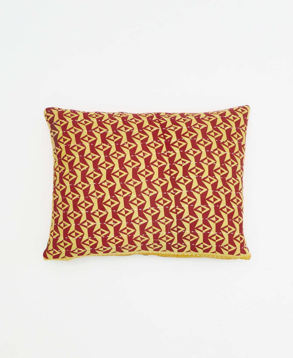 small lumbar pillow in brick red with pastel yellow diamond print with removeable down feather insert