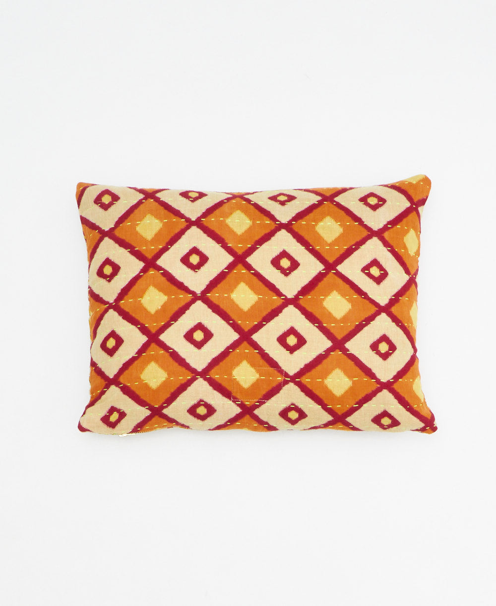 small lumbar pillow in orange with ivory & red bold diamond print with removeable down feather insert