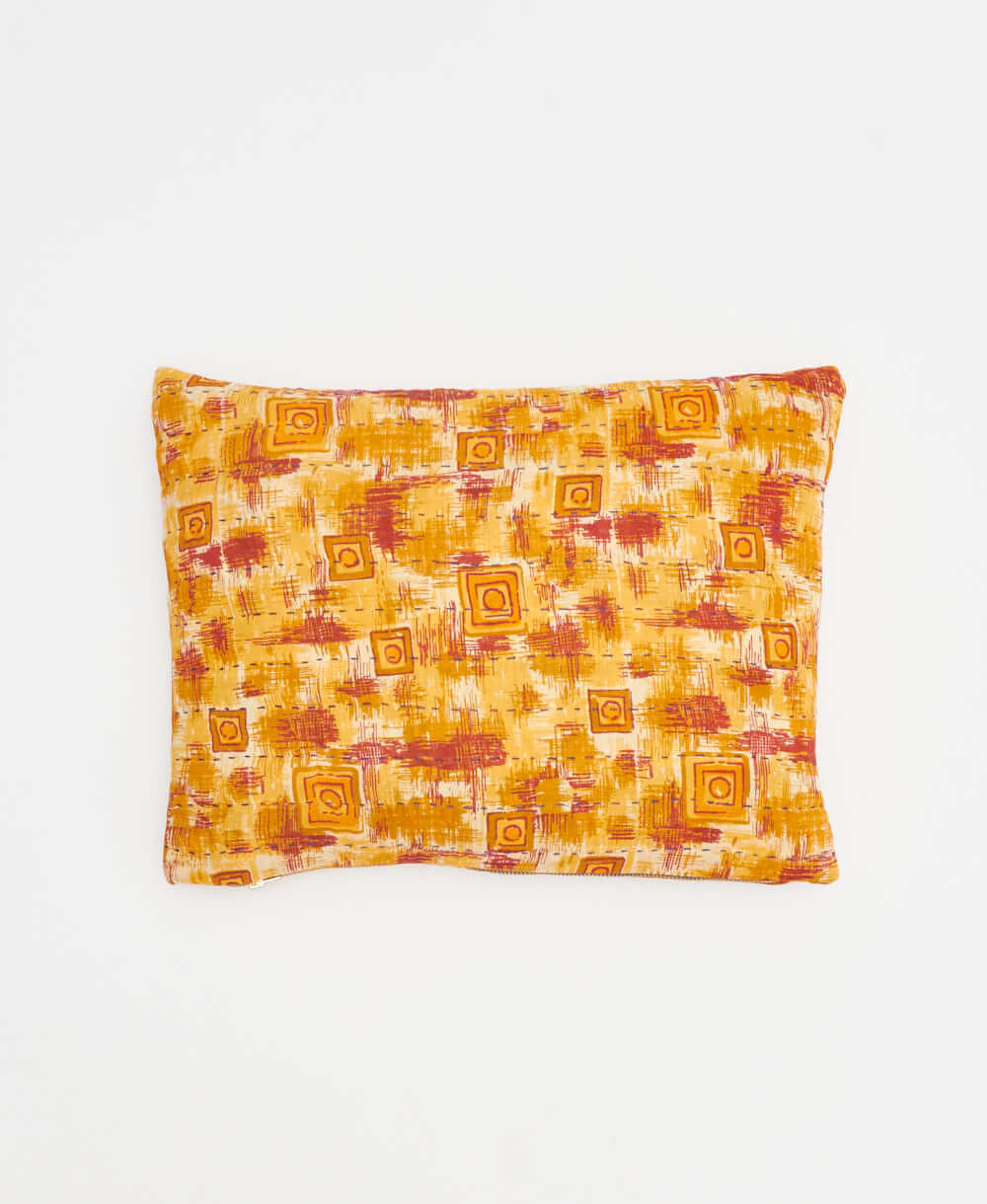 small lumbar pillow in golden yellow with red geometric print with removeable down feather insert