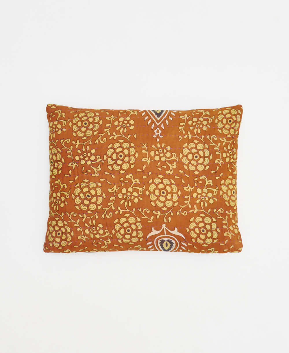 small lumbar pillow in camel brown with light yellow floral print with removeable down feather insert