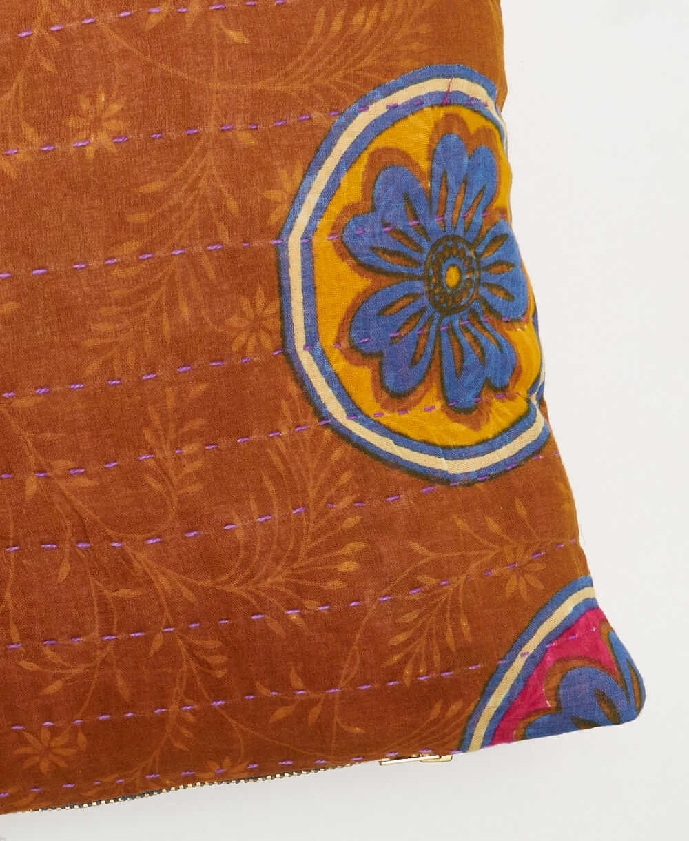 purple kantha embroidery on camel small throw pillow with blue circular floral print