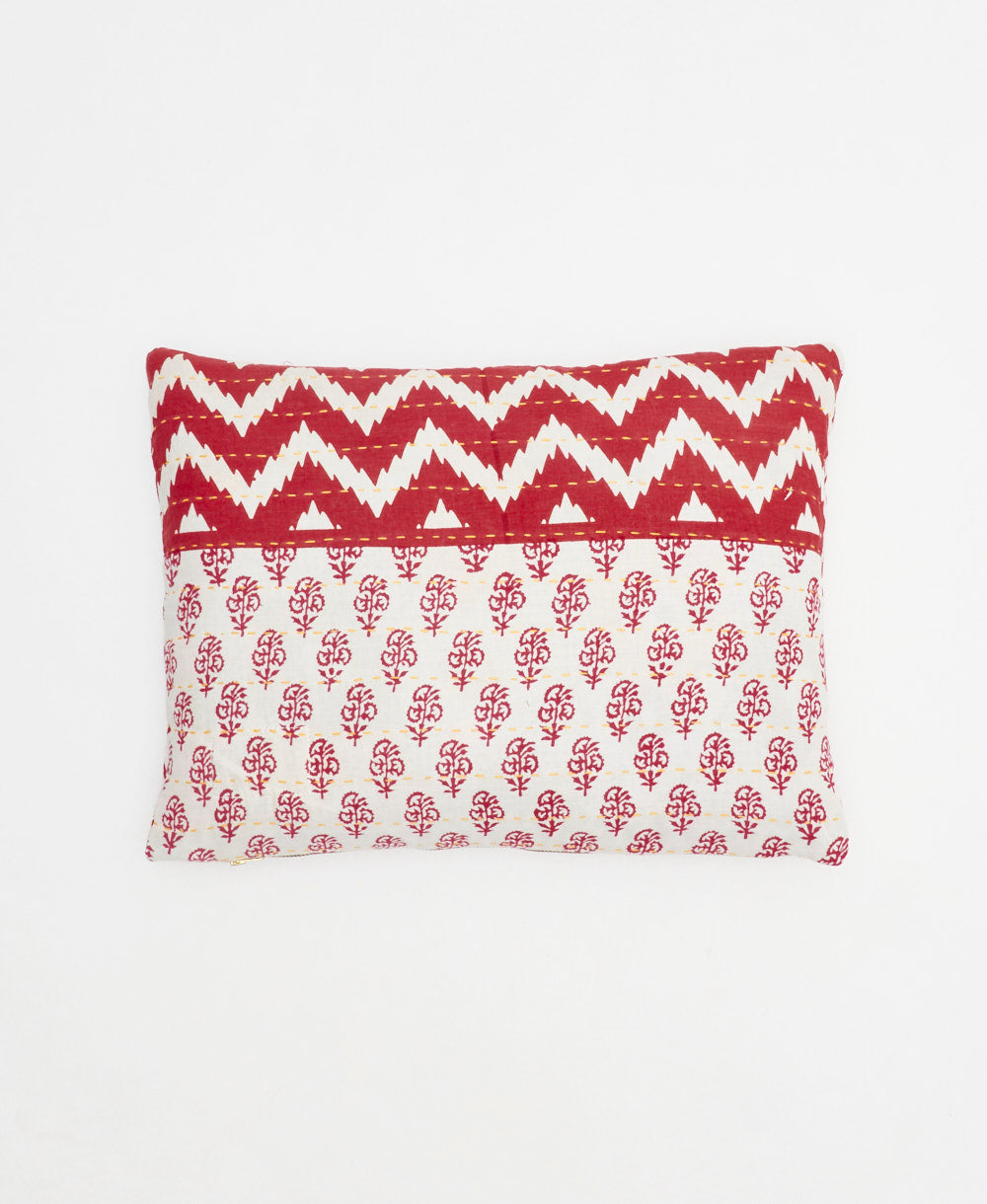 small lumbar pillow in ivory with a red chevron print with removeable down feather insert