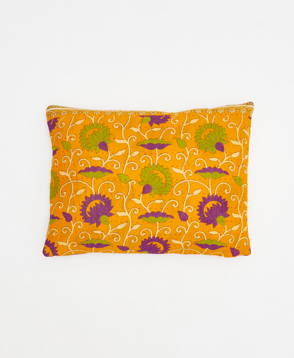 orange small pillow with purple and tan floral print handmade in India from vintage cotton fabrics