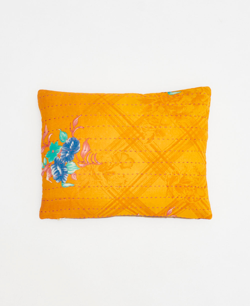 small lumbar pillow in yellow-orange with purple floral print with removeable down feather insert