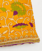 purple kantha embroidery on yellow-orange small throw pillow with a bold floral print