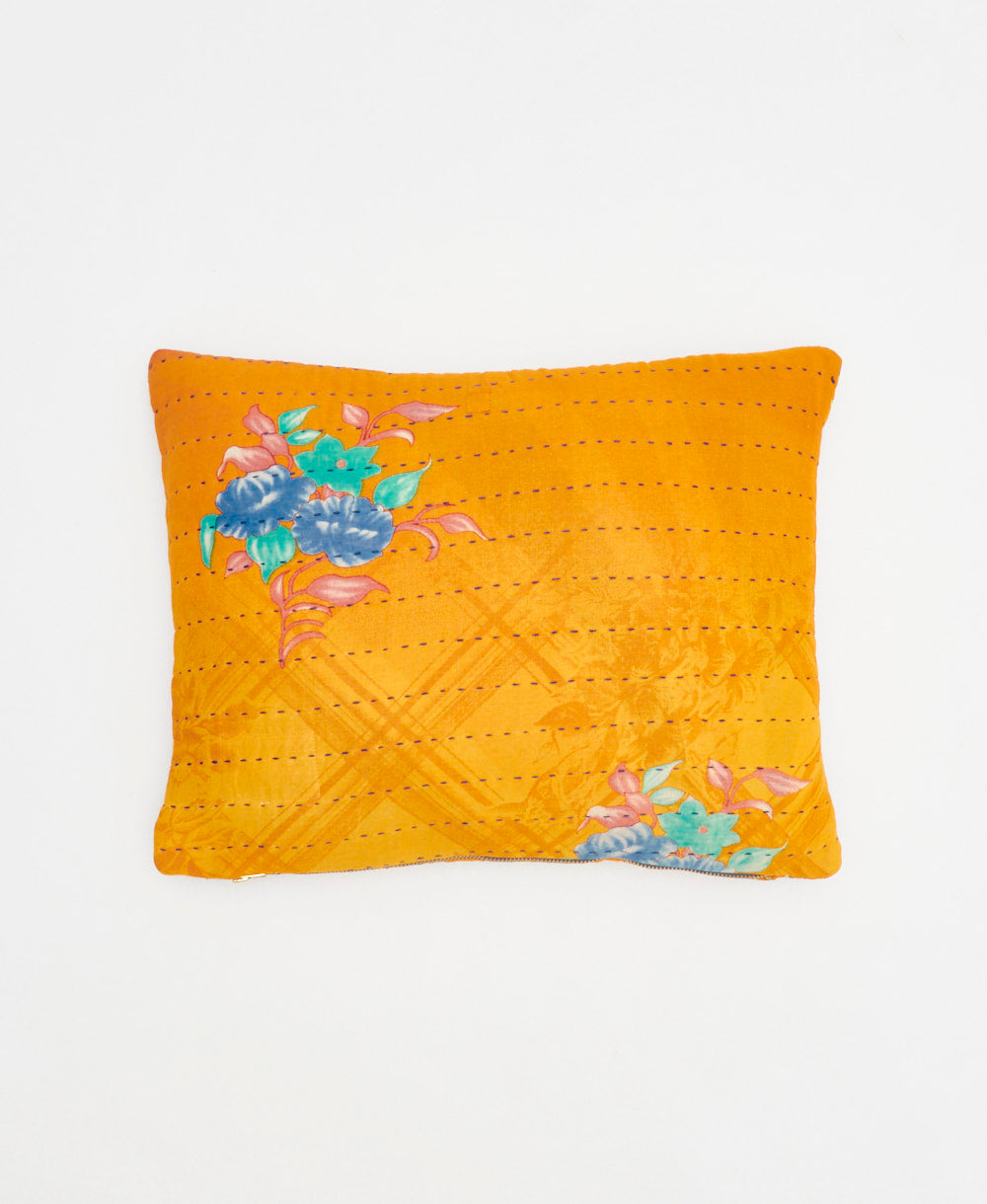 small lumbar pillow in orange with tropical floral print with removeable down feather insert