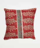 bright red throw pillow in tan floral print with black graphic stripe down the center