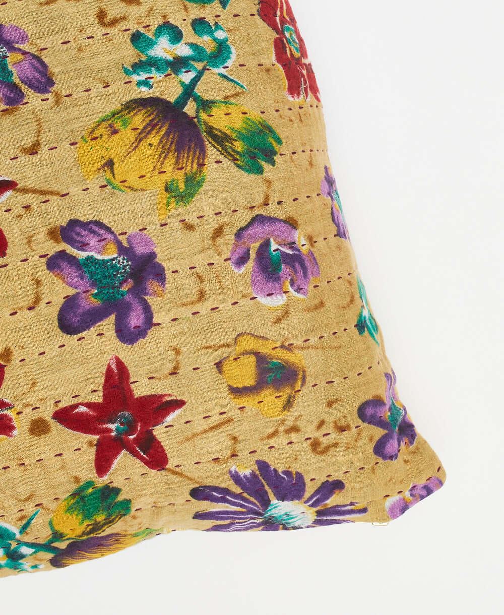 tan floral throw pillow with hand-stitched kantha embroidery on both sides