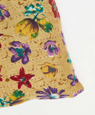 tan floral throw pillow with hand-stitched kantha embroidery on both sides