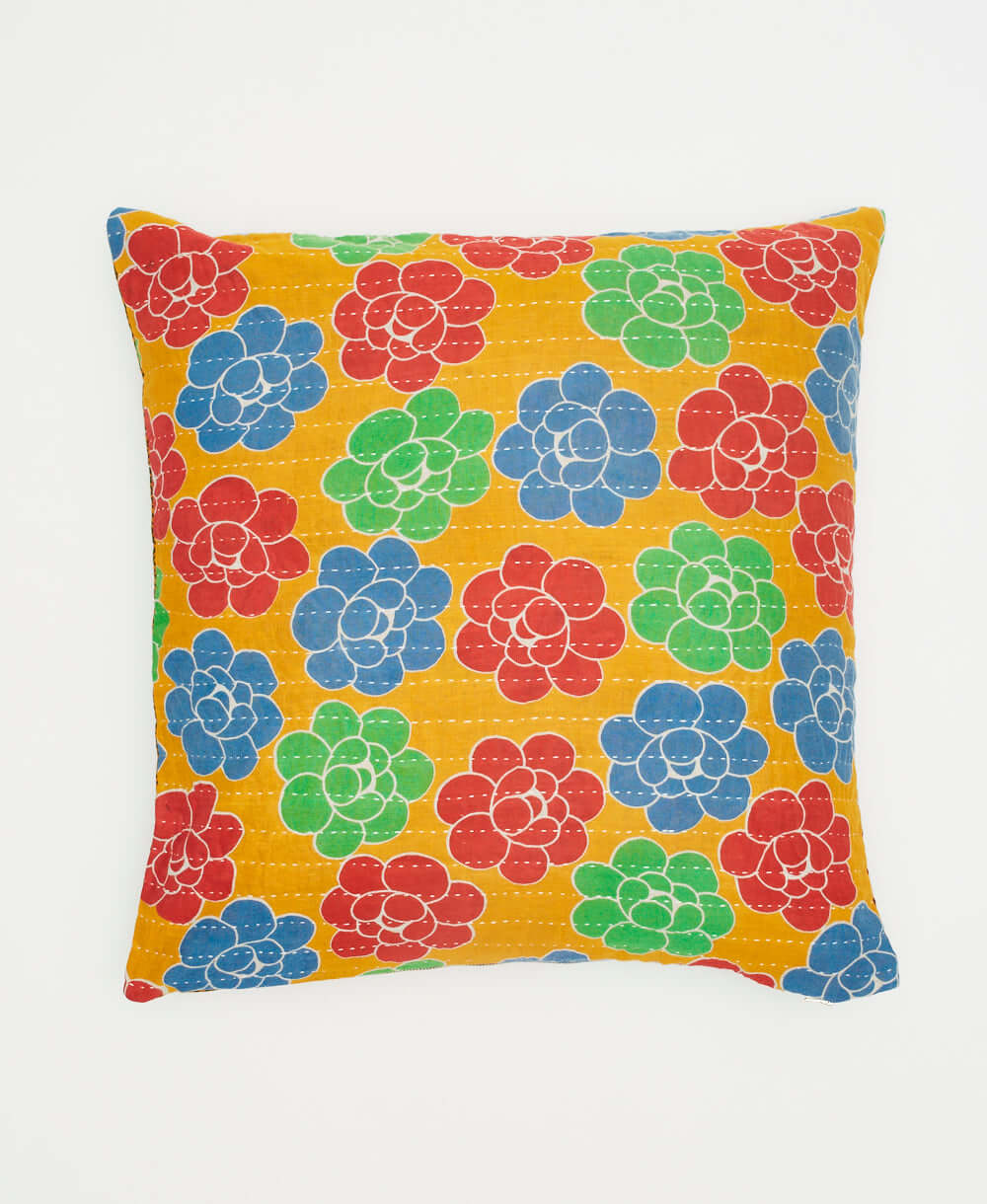 yellow-orange square pillow with bold red, blue and sea green graphic florals handmade in India