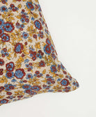 hand-embroidered square pillow with reversible floral patterns on each side