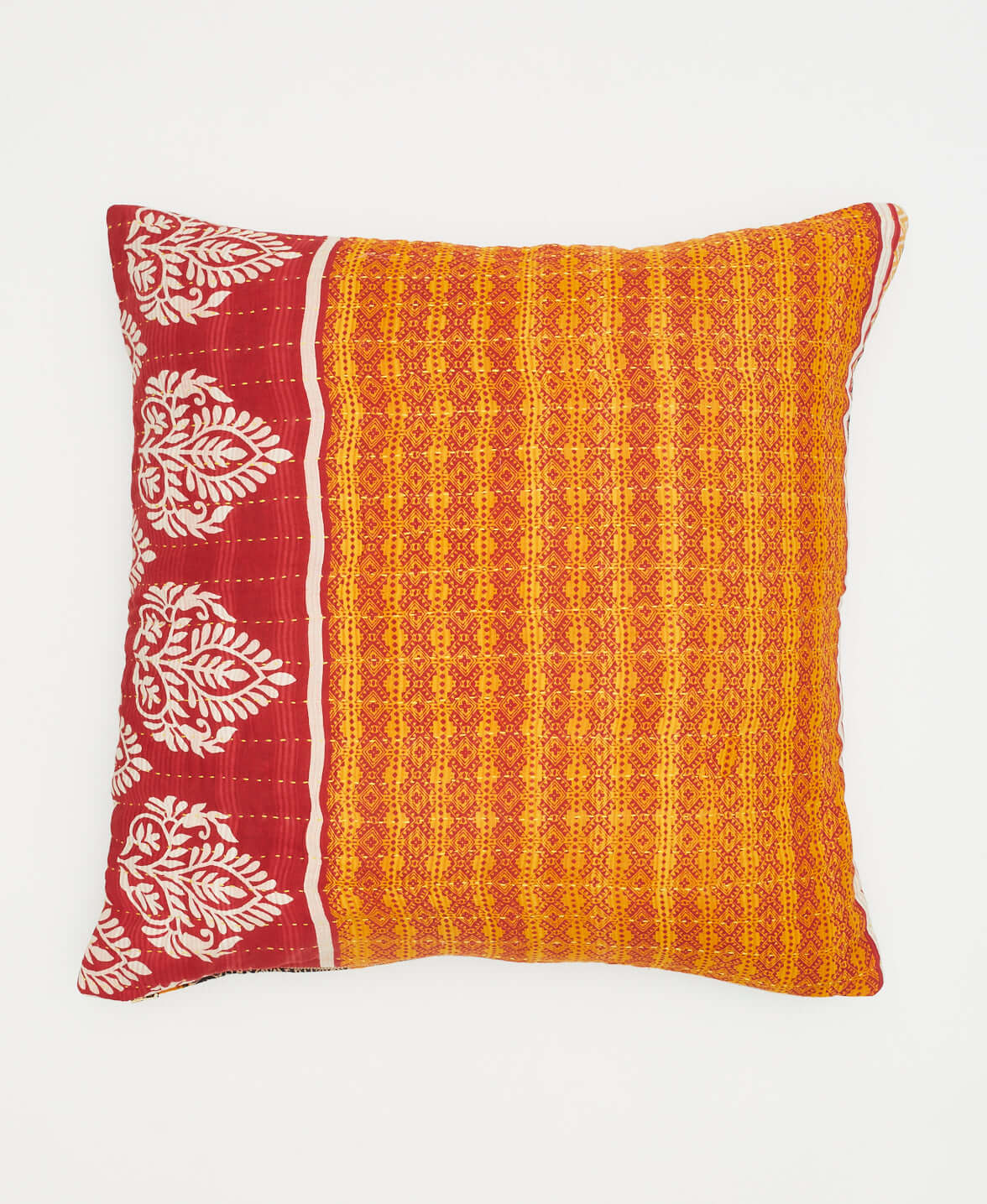 orange throw pillow with red and white paisley design with reversible prints on each side