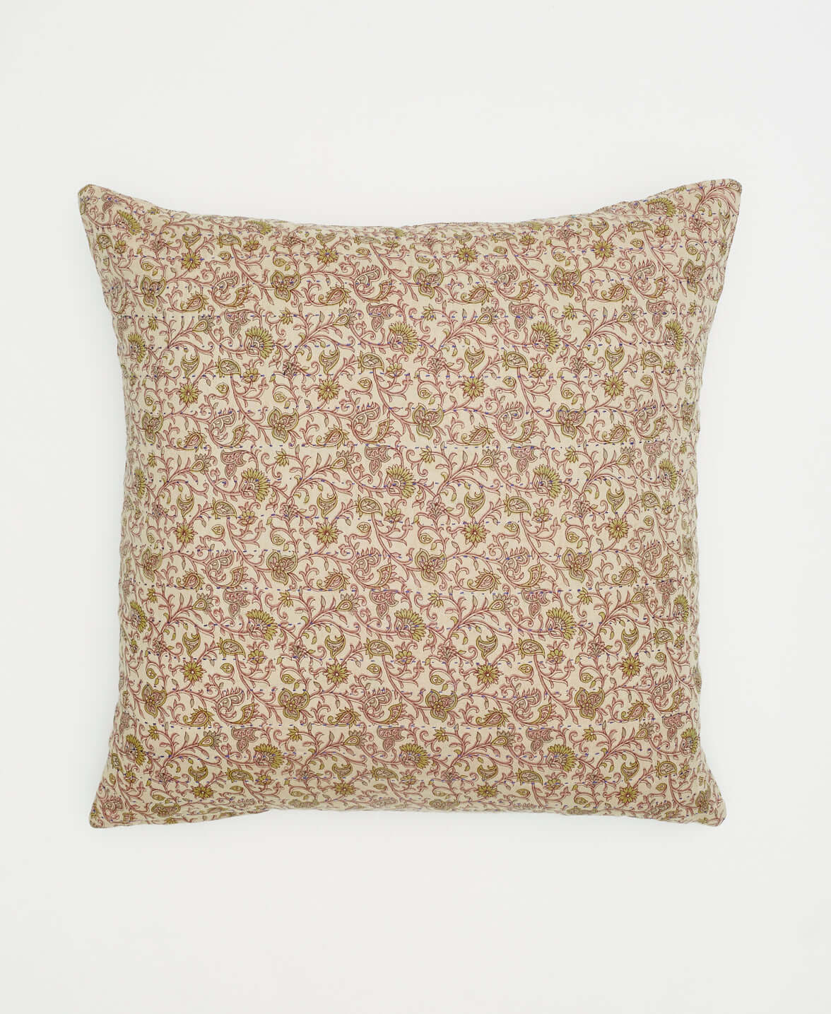 light tan and pink square throw pillow with reversible patterns on front and back