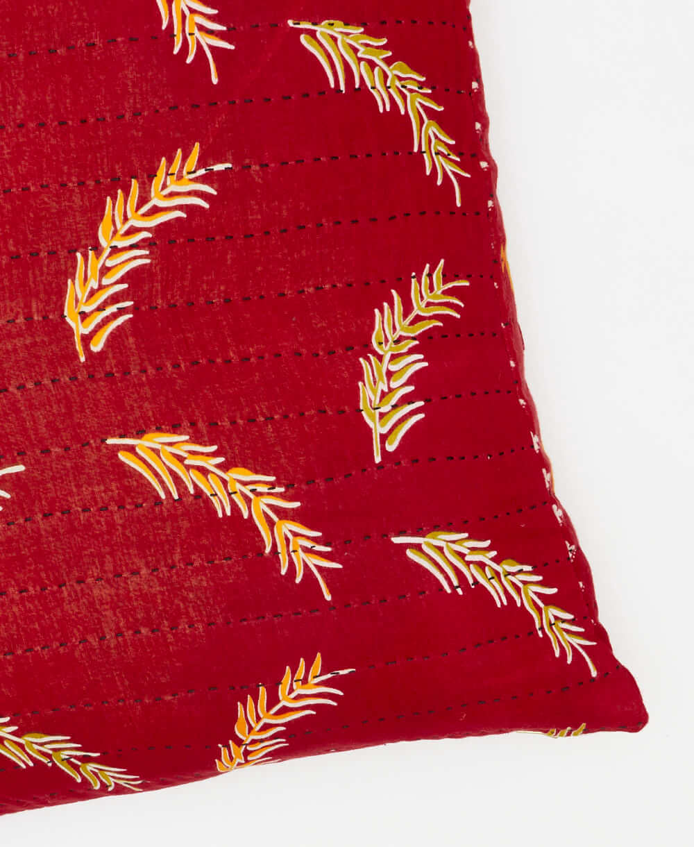 square pillow featuinrg a leaf deign and traditional kantha hand stitching 