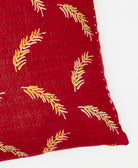 square pillow featuinrg a leaf deign and traditional kantha hand stitching 