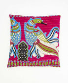 hot pink throw pillow with a sky bue graphic peacock print made from vintage cotton saris in India