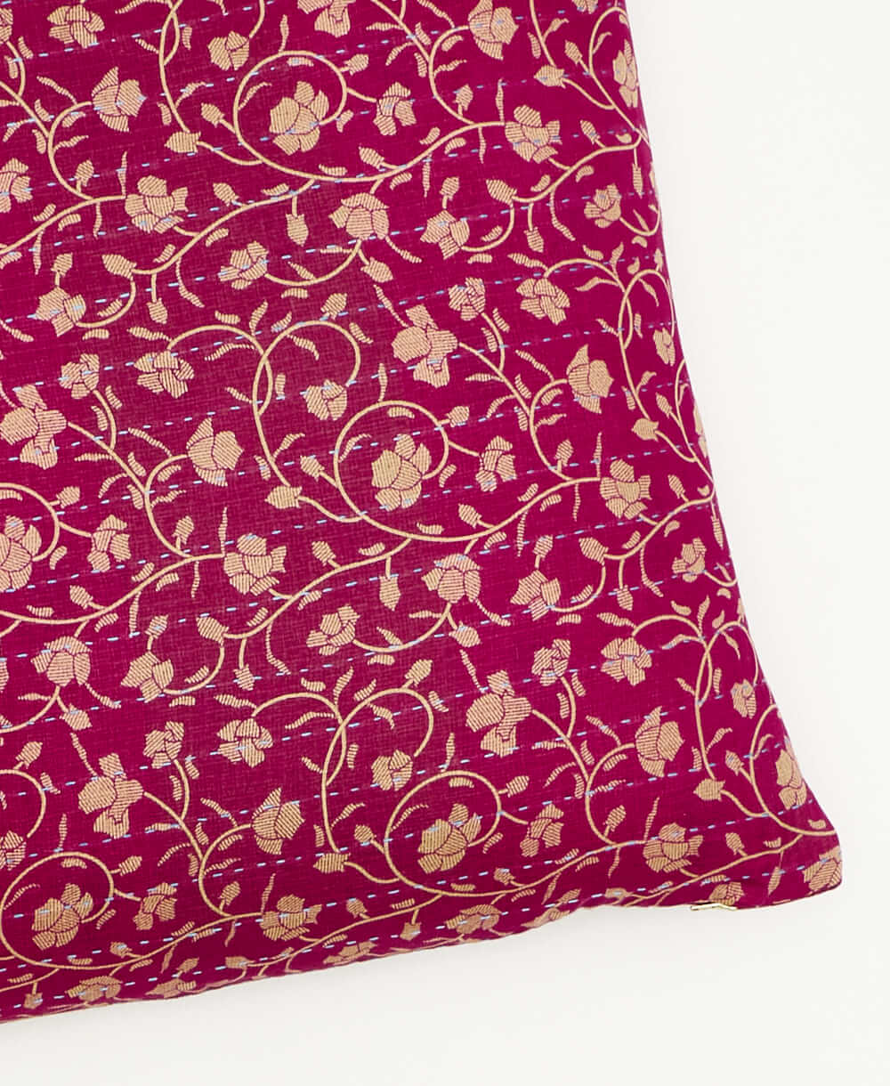 kantha square pillow in magenta with tan floral pattern with sky blue embroidery