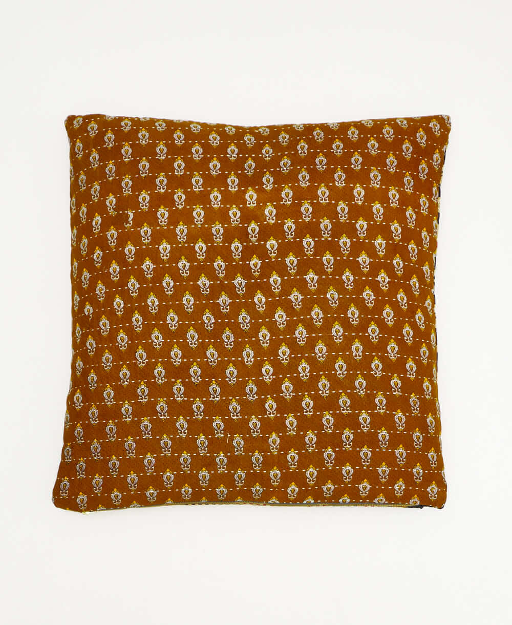 colorful throw pillow in black and red made from vintage fabrics with hand-stitched embroidery in mustard chevron print