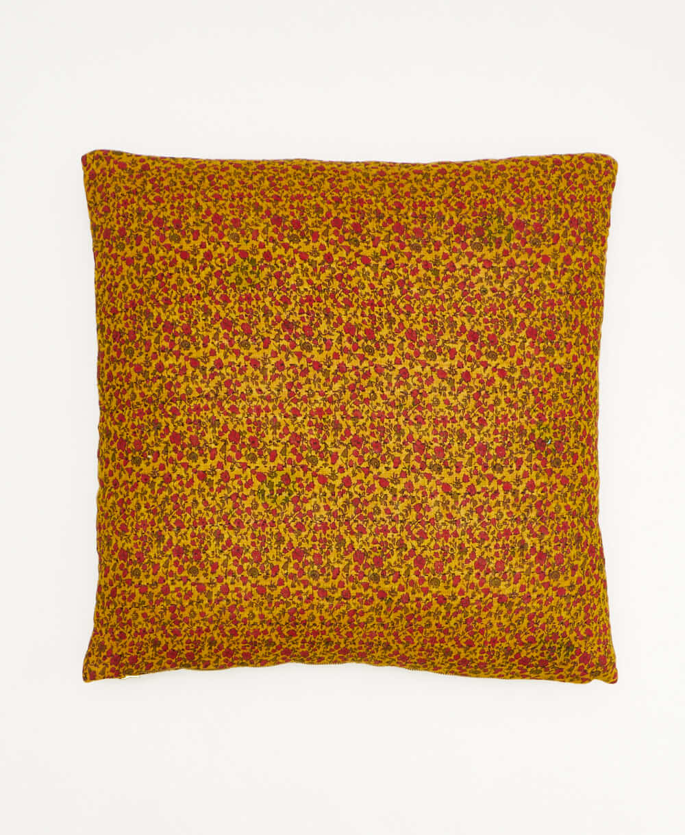 colorful throw pillow in mustard yellow made from vintage fabrics with hand-stitched embroidery in hot pink peacock print