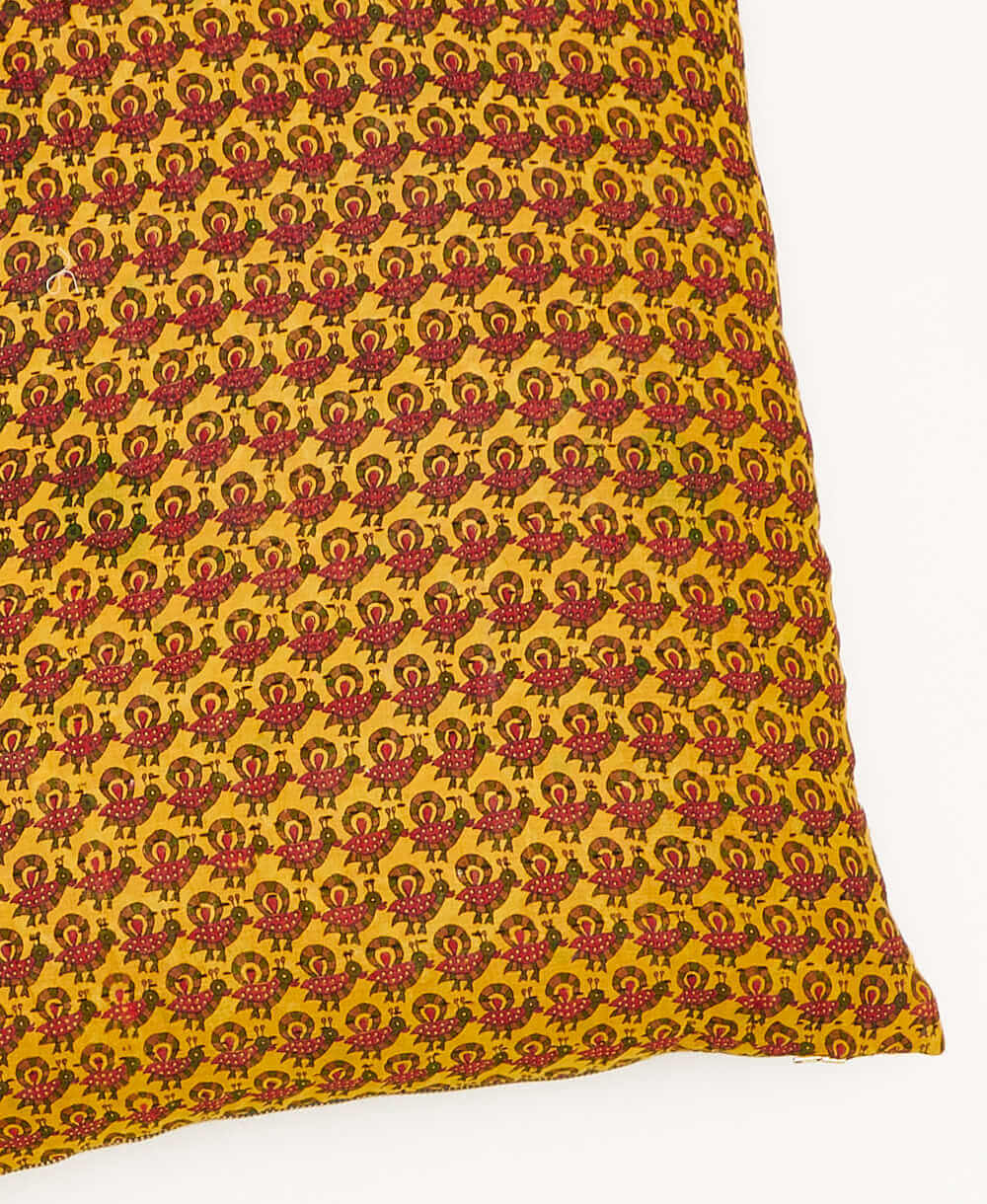 kantha square pillow in mustard with hot pink peacock pattern with black embroidery