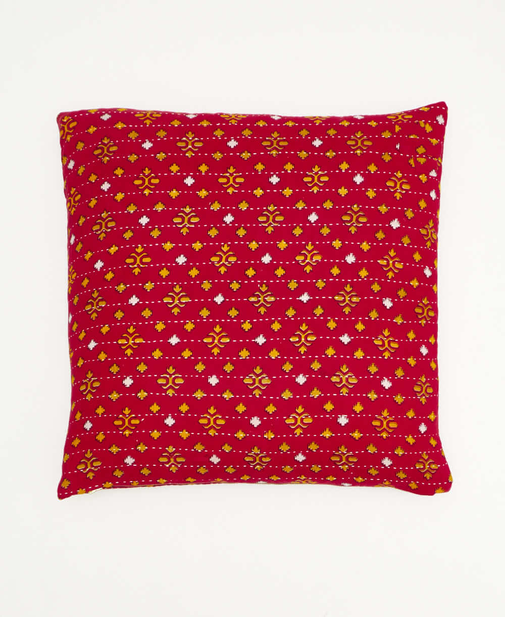 colorful throw pillow in red made from vintage fabrics with hand-stitched embroidery in yellow oversized paisley print