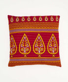 red throw pillow with a yellow oversized paisley print made from vintage cotton saris in India