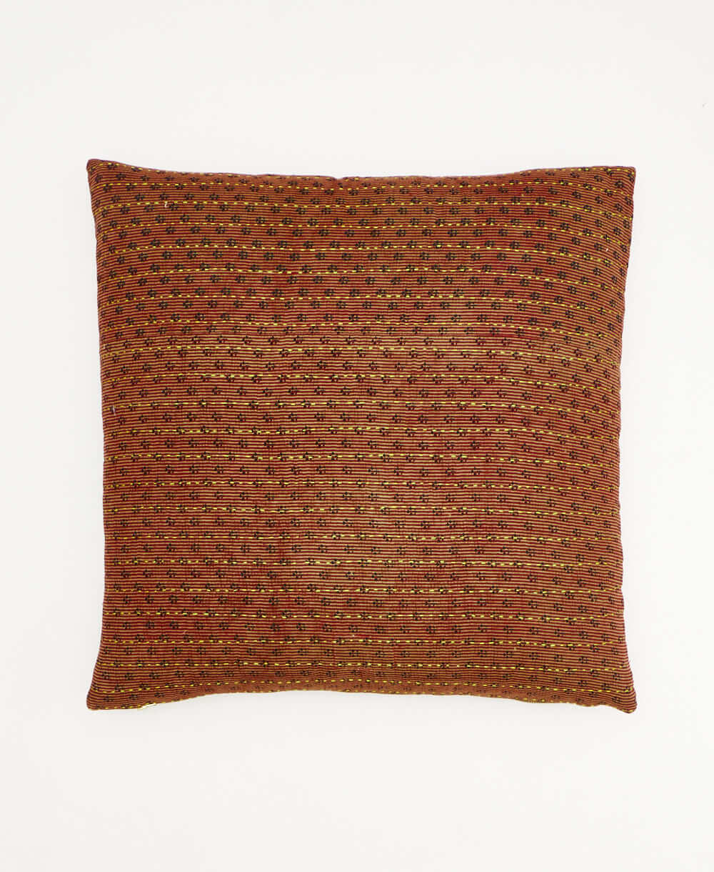 colorful throw pillow in dark red made from vintage fabrics with hand-stitched embroidery in navy & tan paisley print