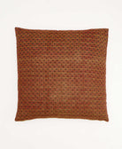 colorful throw pillow in dark red made from vintage fabrics with hand-stitched embroidery in navy & tan paisley print