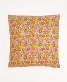 colorful throw pillow in barbie pink made from vintage fabrics with hand-stitched embroidery in yellow paisley print