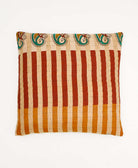 colorful throw pillow in tan made from vintage fabrics with hand-stitched embroidery in emerald & rust floral print