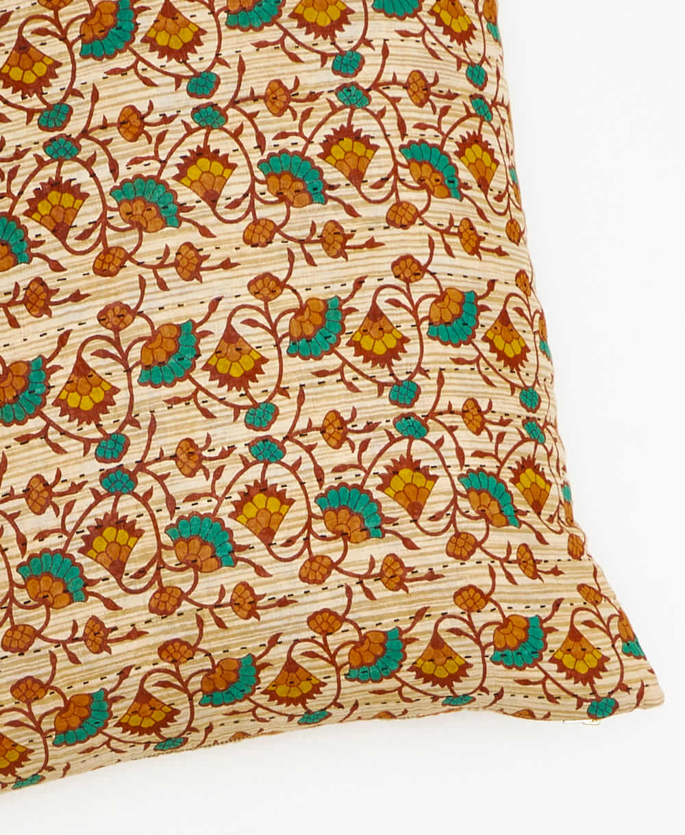 kantha square pillow in tan with emerald & rust floral pattern with black embroidery