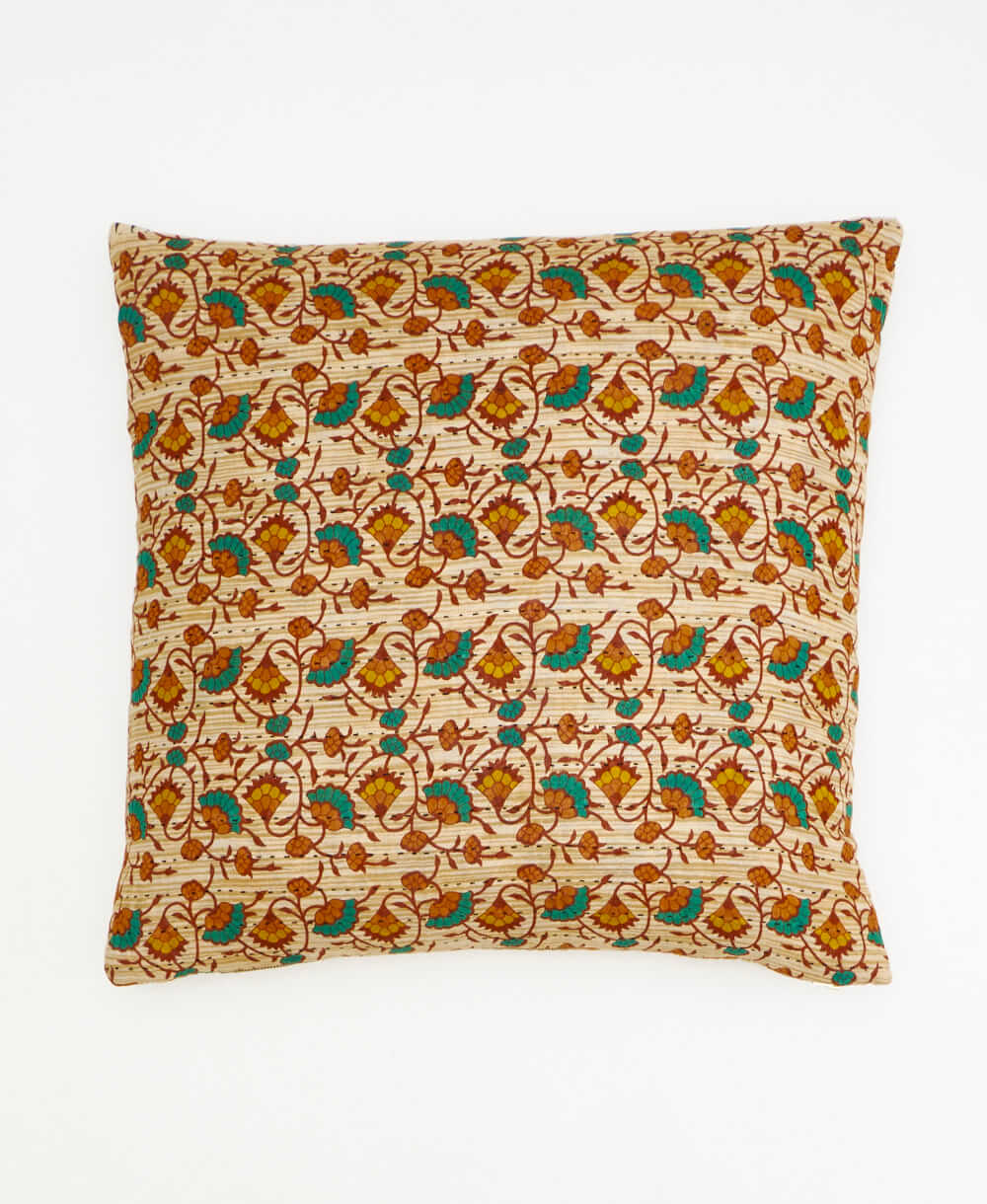 tan throw pillow with a rust & emerald floral print made from vintage cotton saris in India